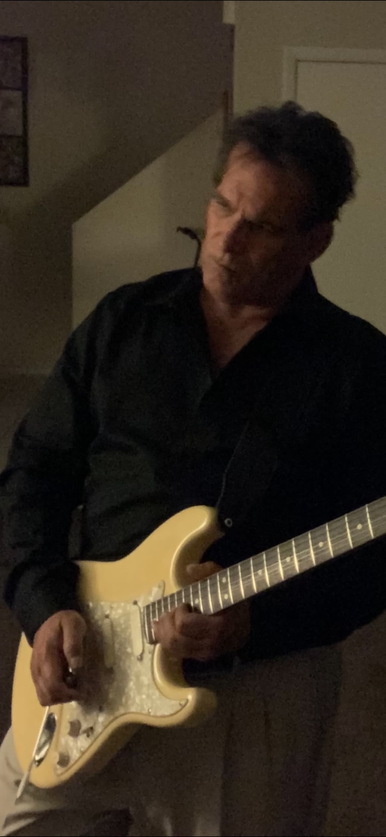 Mark playing electric guitar